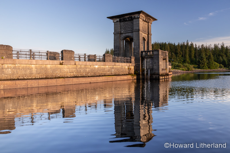 Alwen reservoir dam with reflection, North Wales on a sunny afternoon