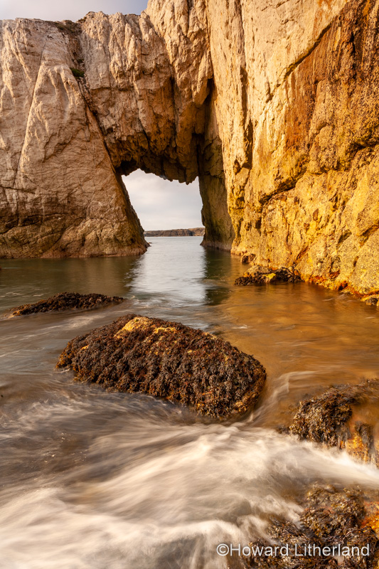 Bwa Gwyn sea arch near Rhoscolyn, Anglesey, North Wales