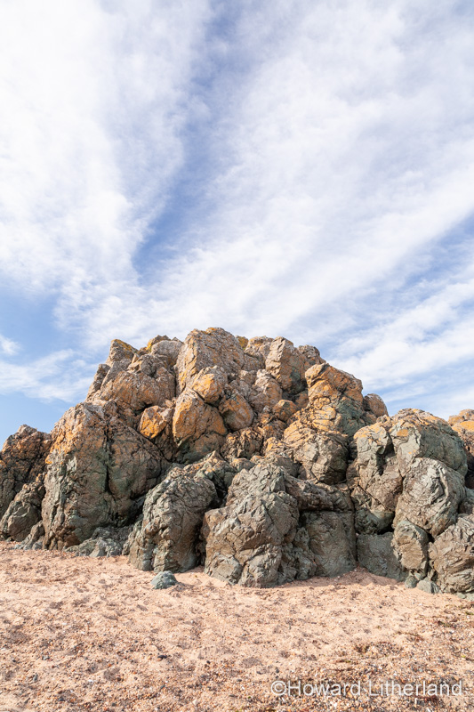 Volcanic rock outcrop at Llanddwyn Island, Newborough Beach, Anglesey, North Wales