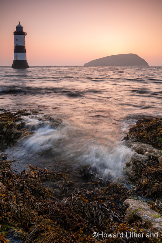 Penmon Point lighthouse and Puffin Island at sunrise, Anglesey, North Wales