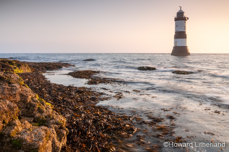 Penmon Point lighthouse at sunrise, Anglesey, North Wales