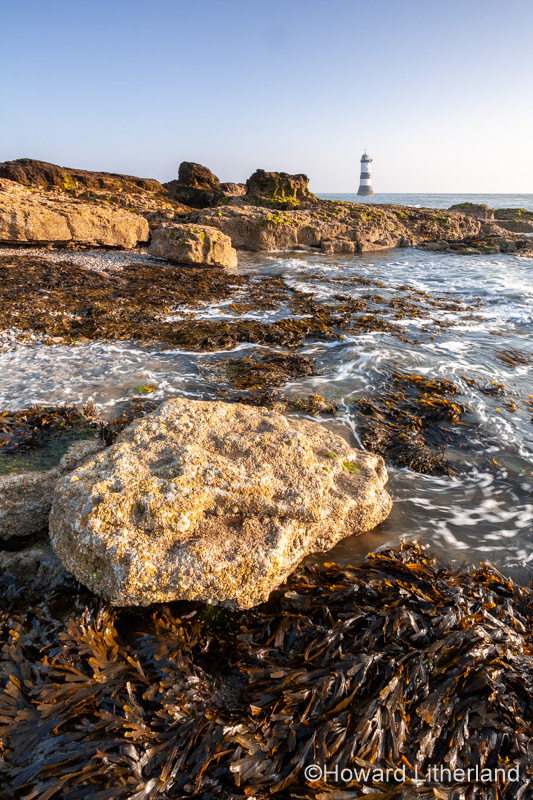 Penmon Point lighthouse at sunrise, Anglesey, North Wales
