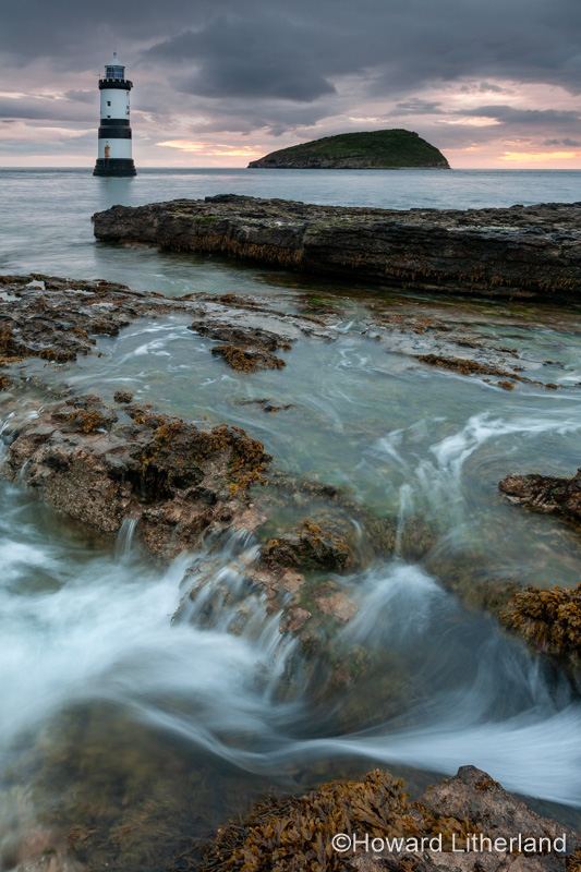 Penmon Point lighthouse and Puffin Island at dawn, Anglesey, North Wales