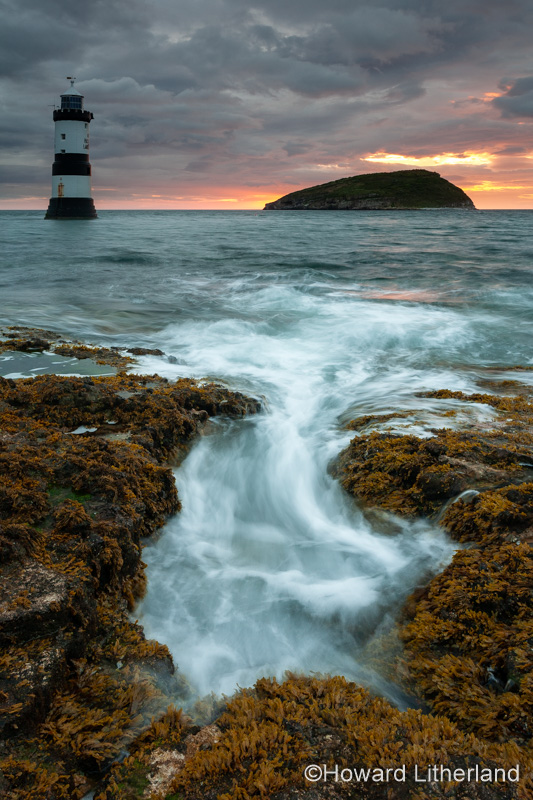 Penmon Point lighthouse and Puffin Island at dawn, Anglesey, North Wales