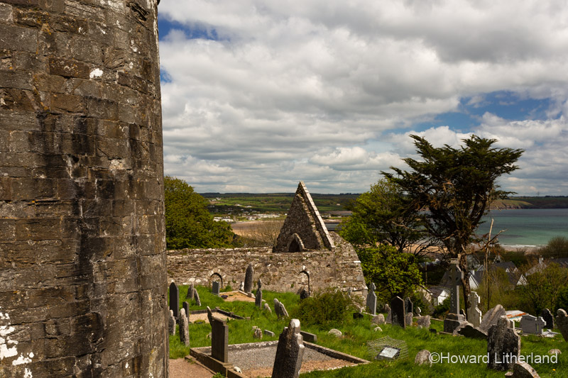 Ancient round tower set in a churchyard at Ardmore County Waterford, Ireland