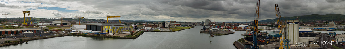 Panoramic image of Belfast harbour in Northern Ireland, featuring the Harland & Wolff shipyard and the Titanic museum