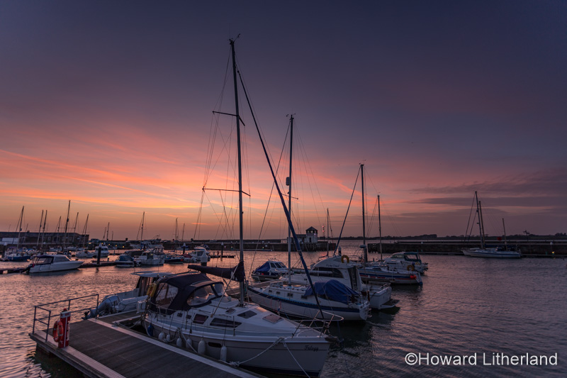 Boats in Victoria Dock at dusk at Caernarfon, North Wales