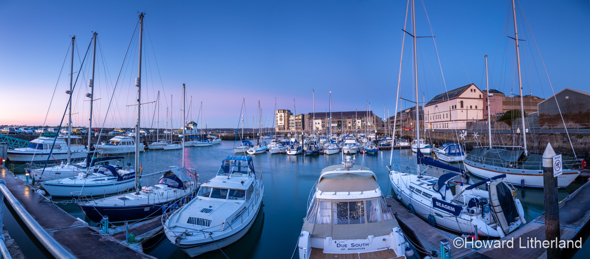 Boats moored in Victoria Dock, Caernarfon, North Wales at sunset