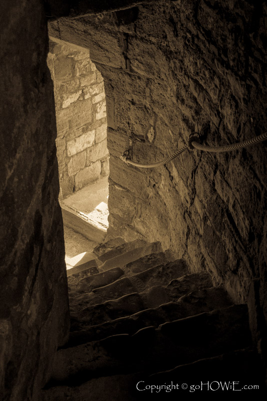 Stone spiral stairs and window inside Caernarfon Castle, North Wales