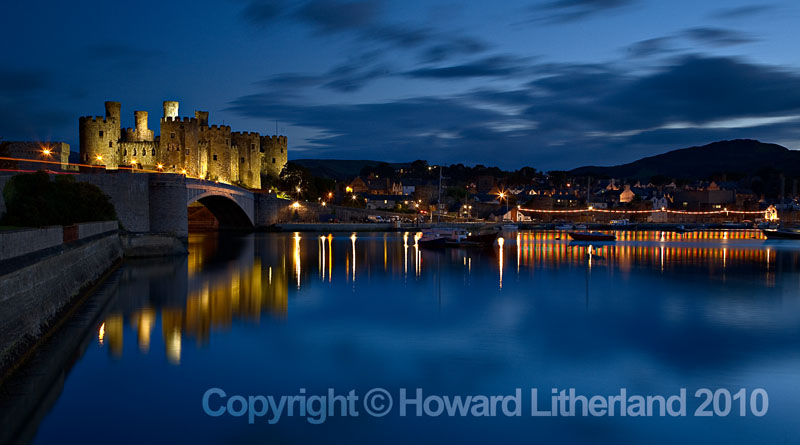 Conway castle and reflection at night, North Wales