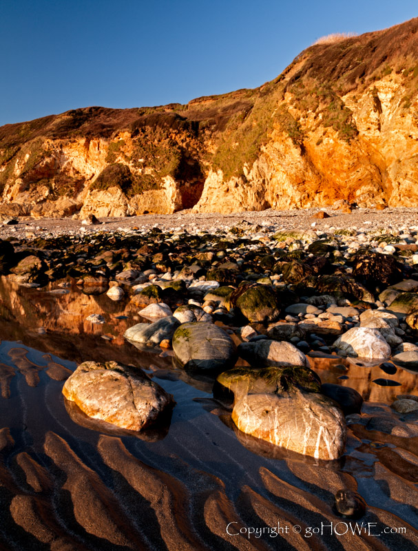 Beach, rocks and cliff at Church Bay, Anglesey
