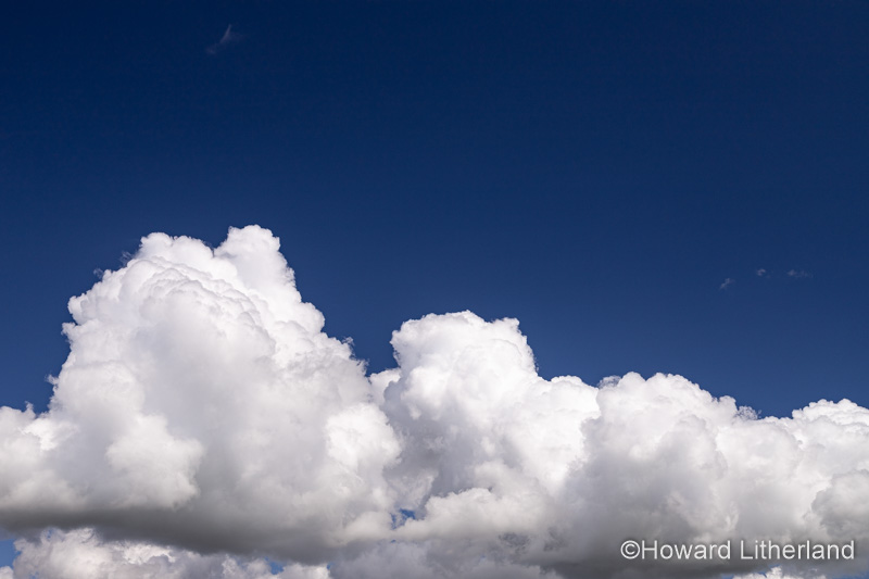 Large cumulus cloud in a deep blue sky