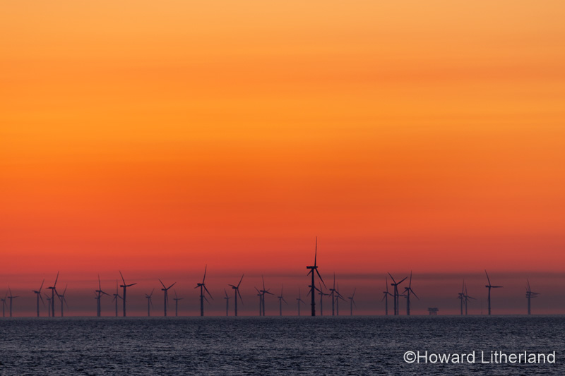 Offshore wind turbines at dawn at Colwyn Bay on the North Wales coast