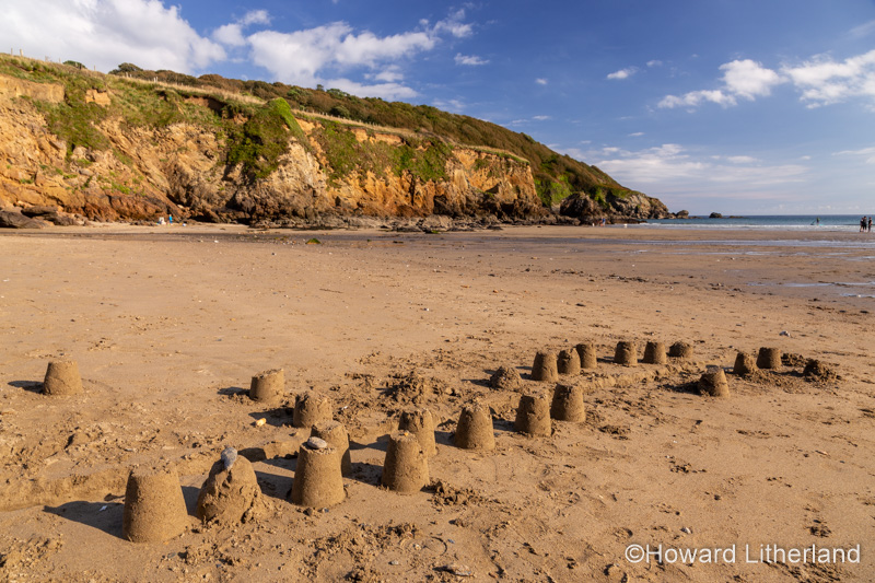 Sandcastles on Porthluney Bay beach, South Cornwall, England
