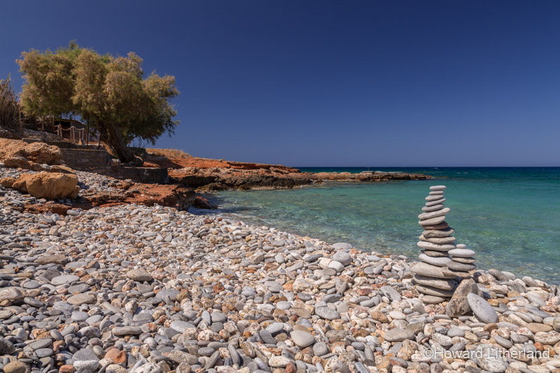 Pillar of balanced pebbles on the Beach Agios Antonios near Kato Selles on the Mediterranean island of Crete