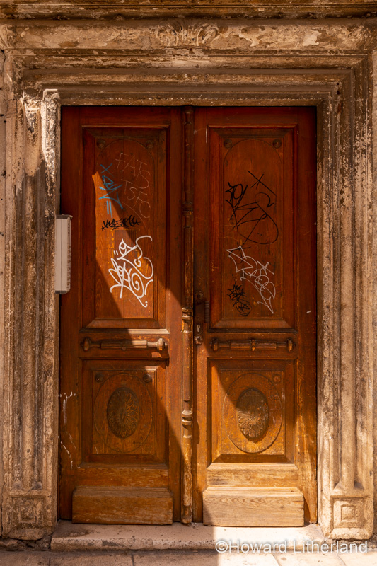 Old graffiti covered door in Spilt, Croatia