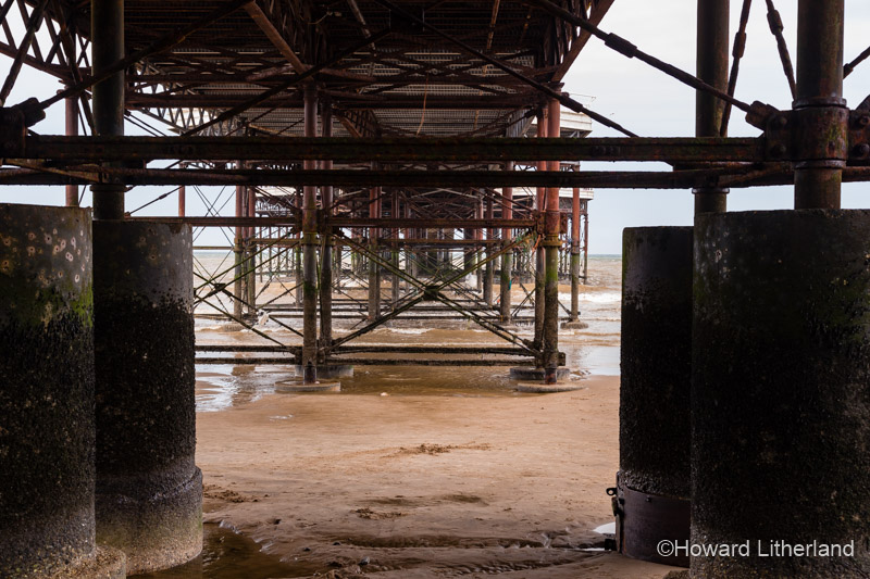 The underneath of the Victorian pier at Cromer on the North Sea coast of Norfolk, England