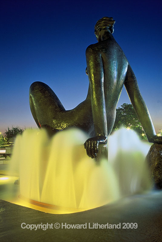 Fountain and statue at night, St Jean de Monts, France