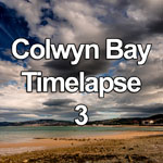Time lapse video showing dramatic clouds, sunlight and shadows passing over Colwyn Bay on the North Wales coast