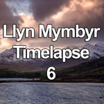 Time lapse video showing storm clouds at sunset over the summit of a snow capped Snowdon as viewed from above Llyn Mymbyr, Snowdonia National Park, Wales