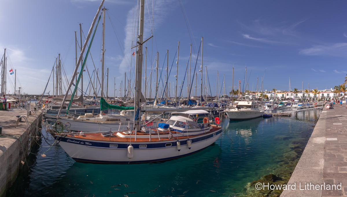Panoramic image of moored boats in the harbour at Puerto de Mogan, Gran Canaria, Canary Islands