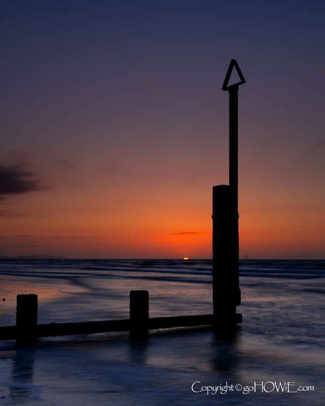 Groynes at sunset, Rhyl, North Wales