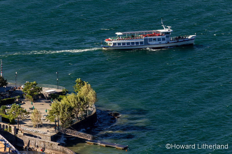 Photo of a ferry boat traversing the centre (Centro Lago) of Lake Como from Varenna in northern Italy