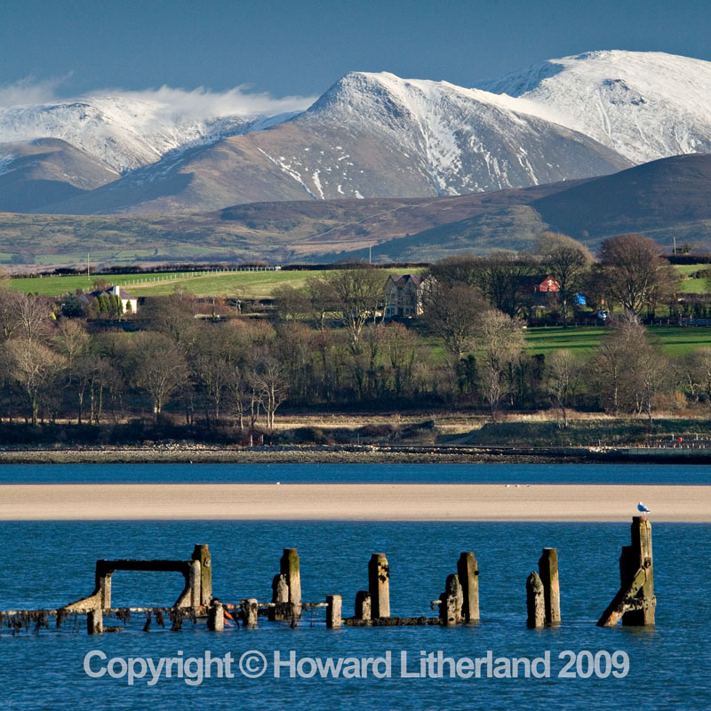 Jetty, mountains and snow, Menai Straits, Anglesey