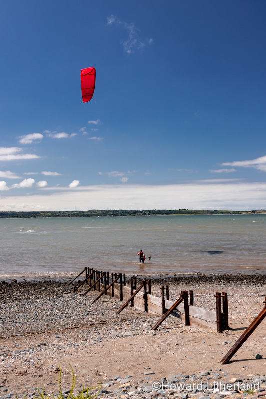 Kite surfer on the beach at Llanfairfechan, North Wales