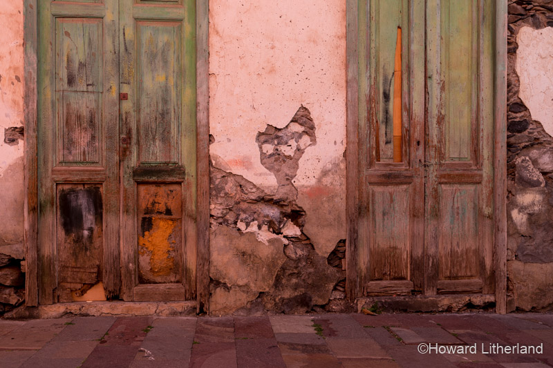 Pair of decaying doors in the back streets of San Sebastian de La Gomera, the capital of La Gomera in the Canary Islands