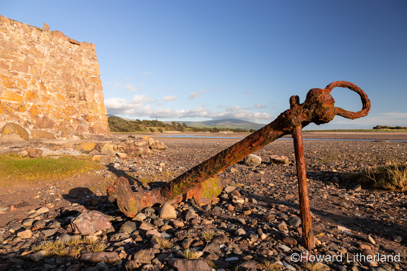 Old rusty anchor on the beach at Ravenglass, Lake District, England