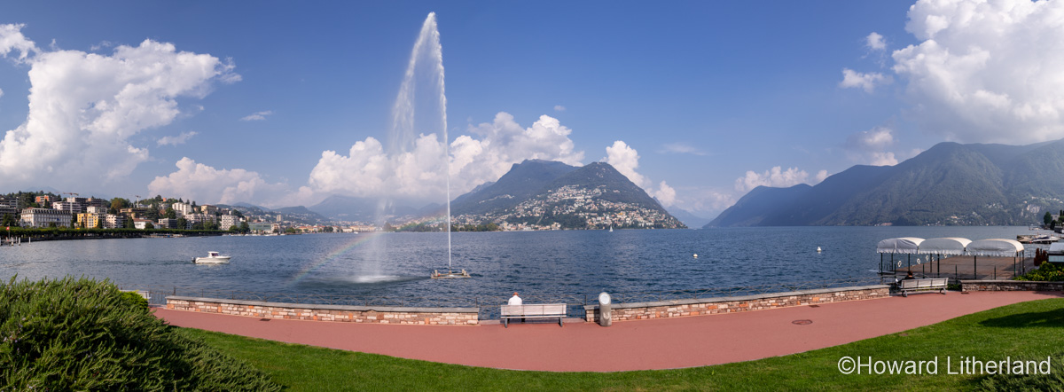 Panoramic image of a fountain by the shore of Lake Lugano at Lugano, Switzerland