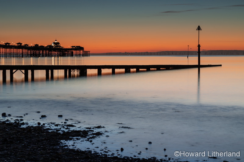 Jetty and pier at dawn on Llandudno North Shore, North Wales