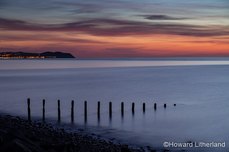 Groynes at dusk at Llandulas on the North Wales coast