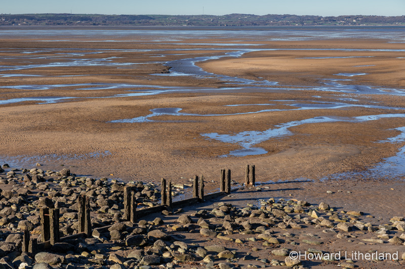 Groynes at Llanfairfechan beach on the North Wales coast
