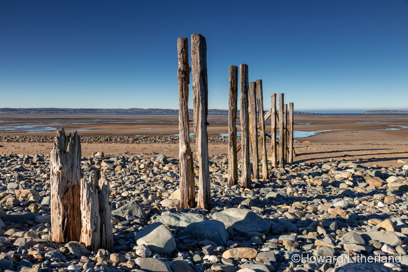 Groynes at Llanfairfechan beach on the North Wales coast