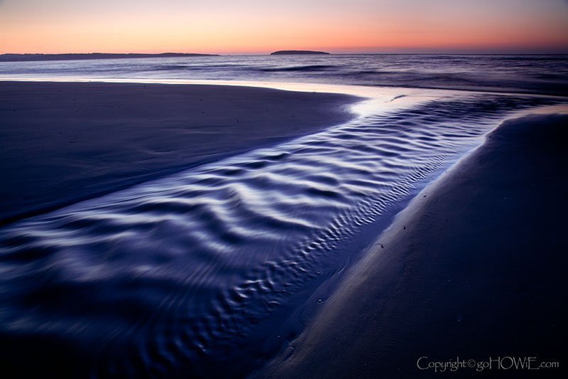 Tidal pool run off at dusk on Llanfairfechan beach, Wales