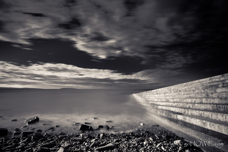 Pebble beach and concrete ramp at Llanfairfechan beach, North Wales coast
