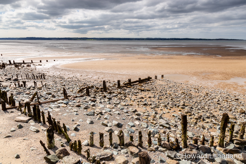 Decaying groynes on the beach at Llanfairfechan, North Wales