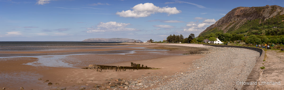 Panoramic image of Llanfairfechan beach, promenade and headland on the North Wales coast