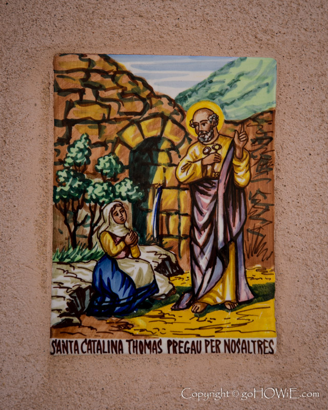 Colourful plaque on the wall of a small church at Port de Valldemossa on the west coast of Mallorca