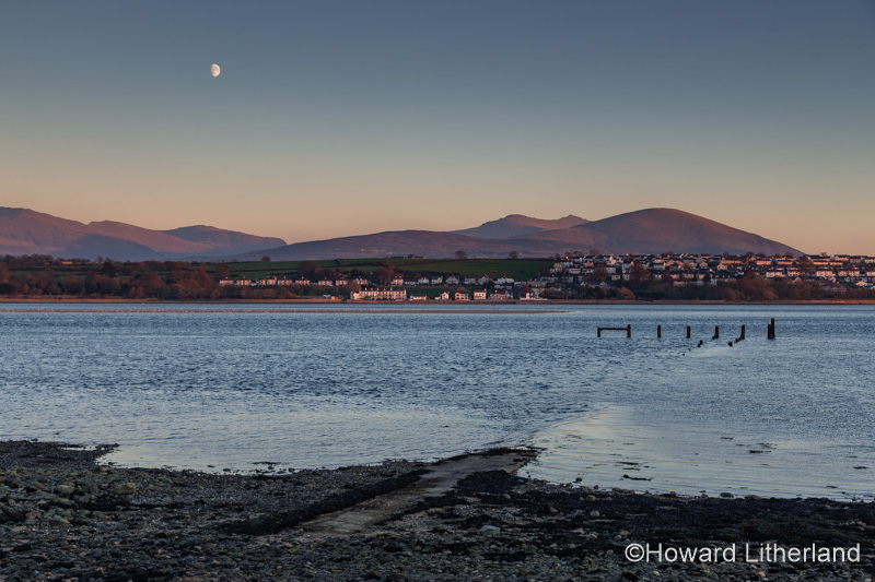 Menai Straits, Anglesey, at sunset with moon over the North Wales coast