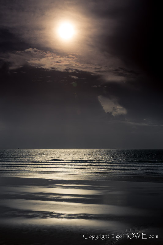 Sun reflecting off the sea and sand at Newgale beach, Pembrokshire National Park, Wales