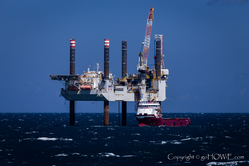 Oil rig and support vessel in the North Sea, photographed from the P&O cruise liner Azura