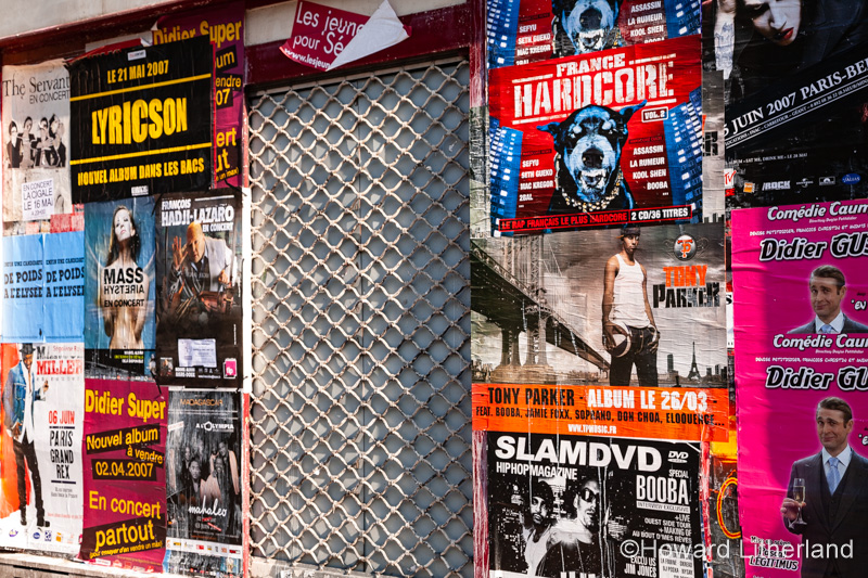 Music posters on a shopfront, Paris, France