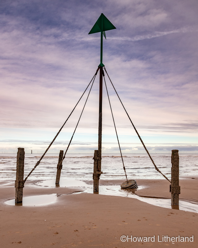 Marker post on Prestatyn Beach, North Wales