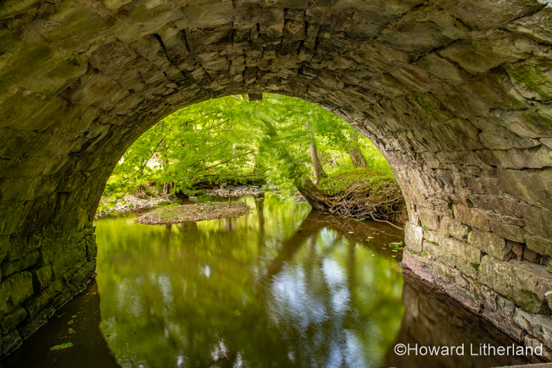 Old stone bridge over the River Alyn at Maeshafn, North Wales