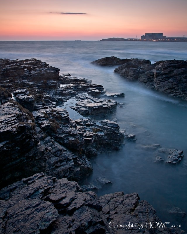 Rocks, sea and Wylfa nuclear power station, Cemlyn, Anglesey
