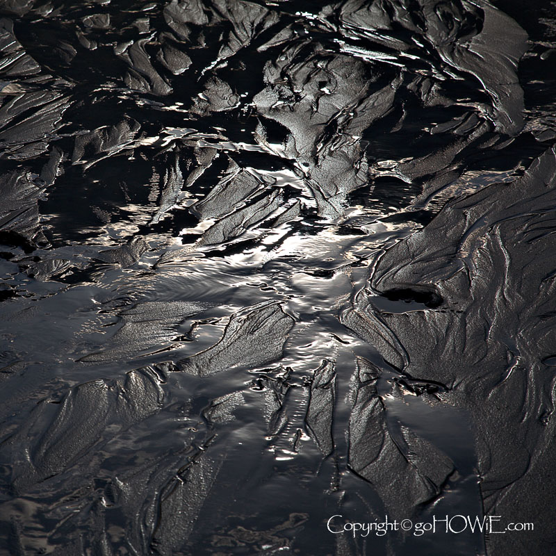 Sunlit ripples in the sand at Porth Dafarch, Anglesey, North Wales