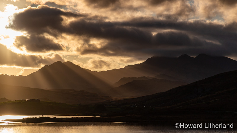 Sunbeams and storm clouds over Snowdon and Llyn Mymbyr, Snowdonia, North Wales